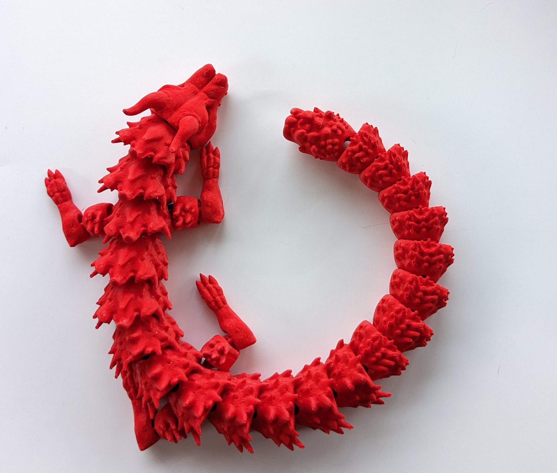 Red 3D printed articulated dragon