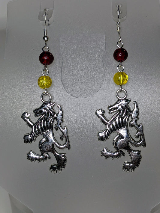 Close up of silver lions rampant facing left wirh red & yellow crackle glass bead accents 