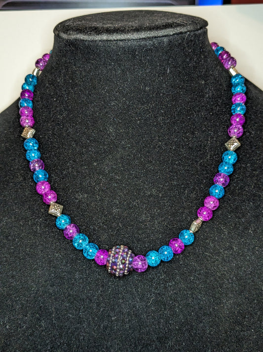 Bright blue & purple beaded necklace with an iridescent beaded bed focal 
