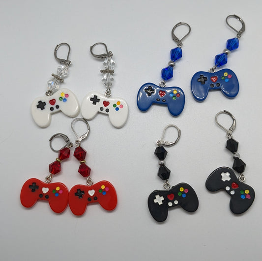 4 pairs of game controllers earrings with matching bi cone beads on a white background. 