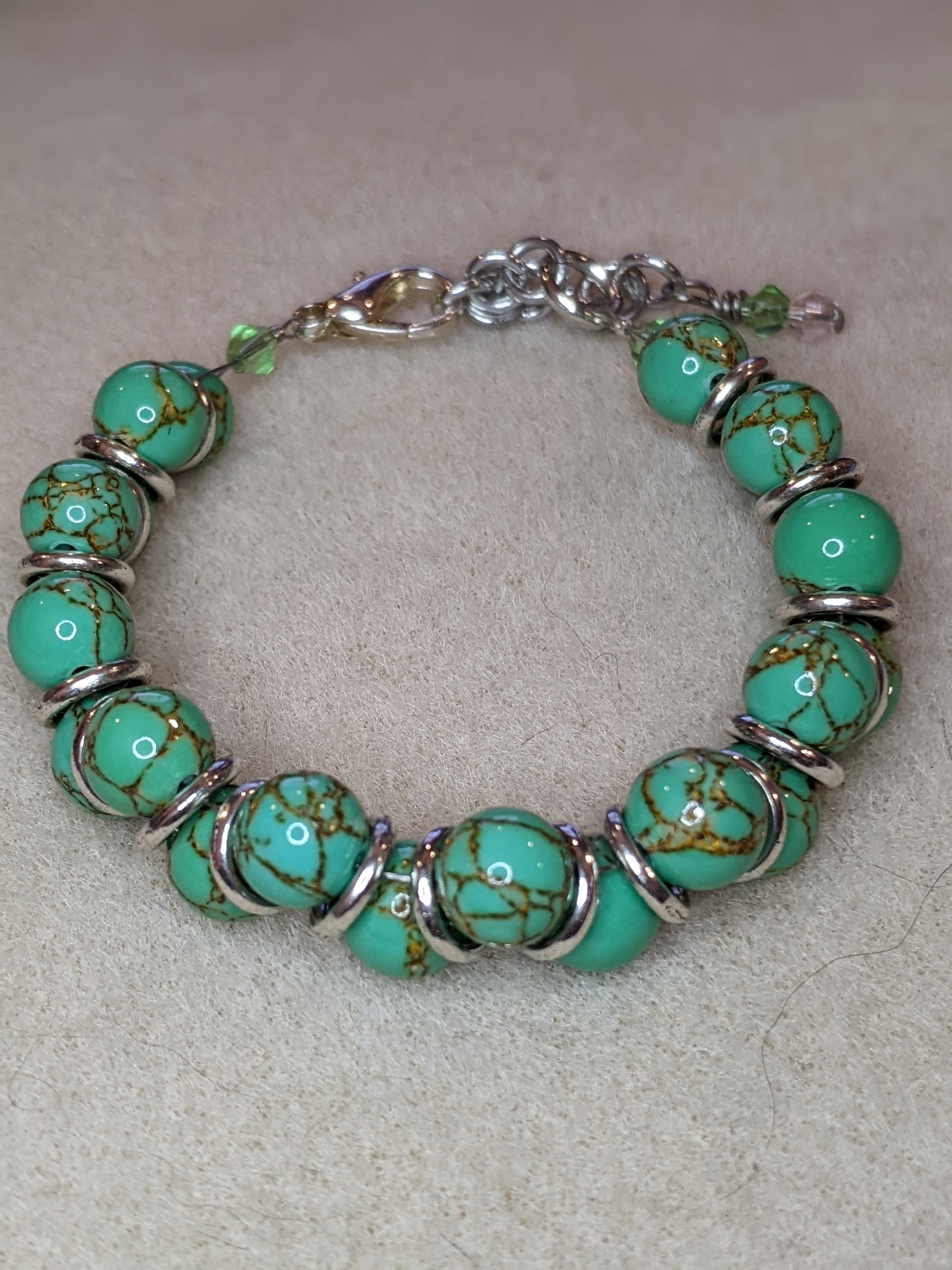 Green ceramic mosaic beaded Goddess style bracelet.  Beads are green ceramic with copper vening